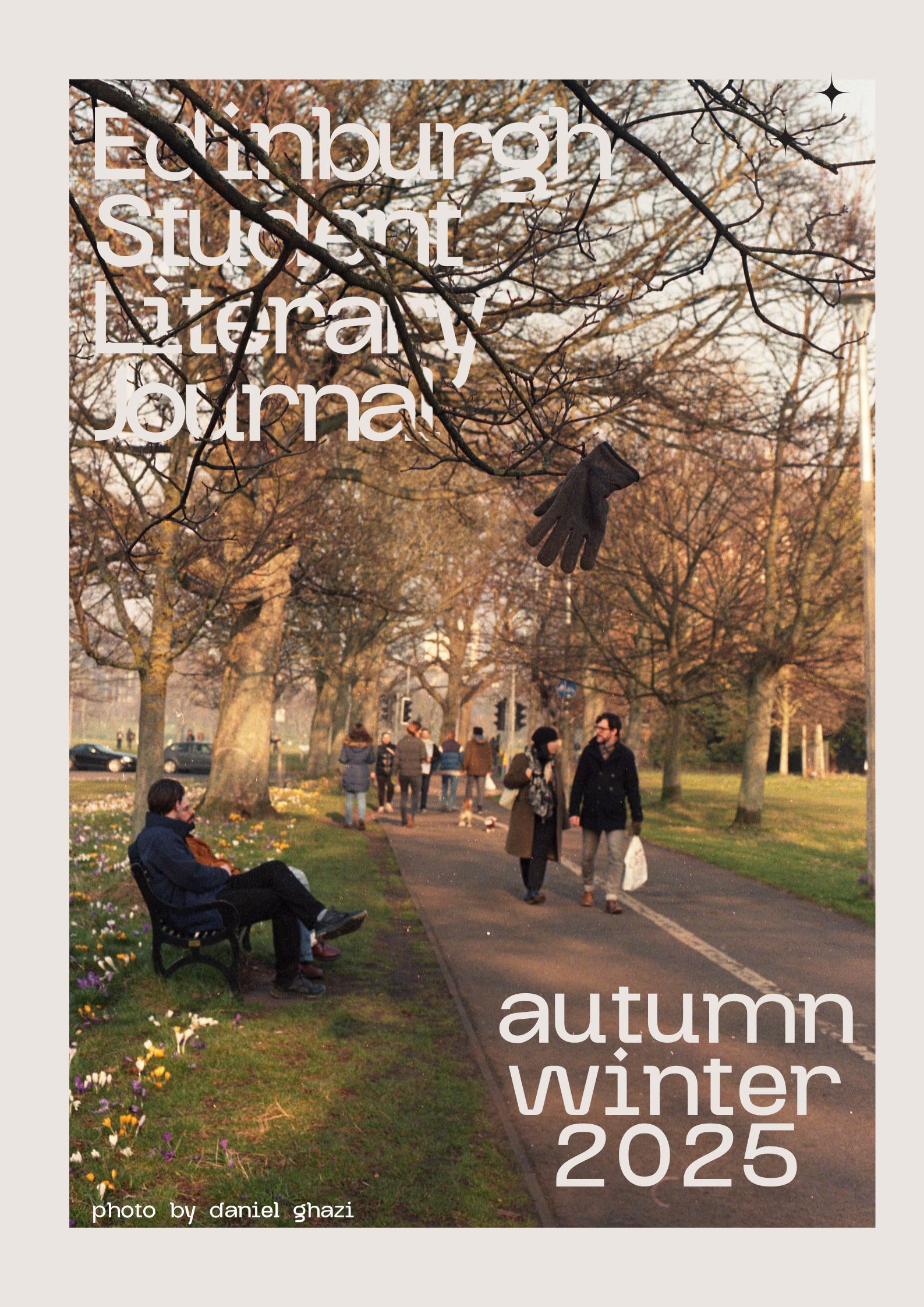 cover for the autumn winter 2025 issue with a photo showing people walking through a park and a glove in a tree by Daniel Ghazi